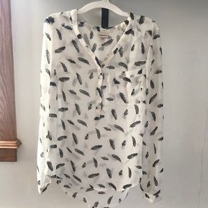 White blouse with feathers